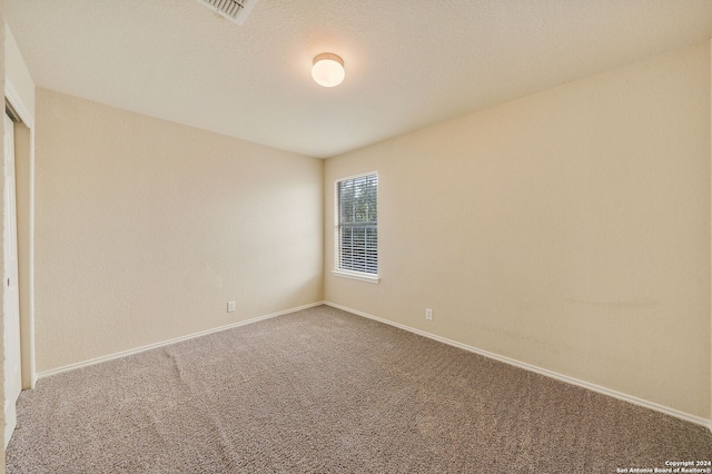 unfurnished room with carpet flooring