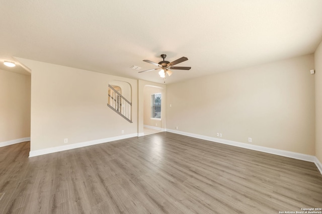 spare room featuring hardwood / wood-style flooring and ceiling fan