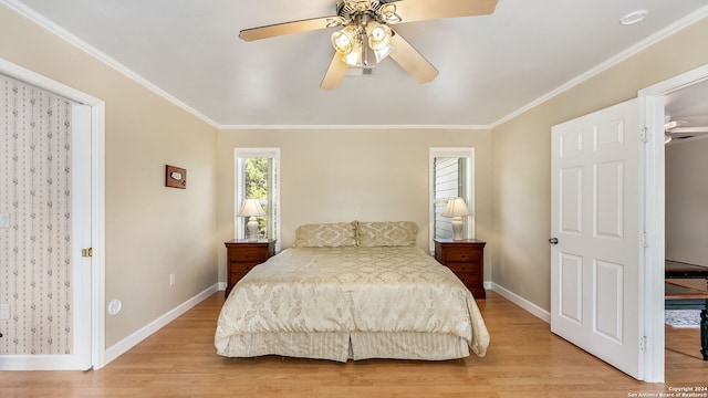 bedroom with ceiling fan, light hardwood / wood-style floors, and crown molding