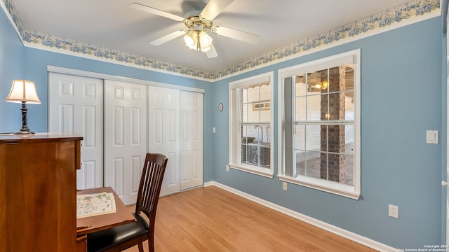 office area featuring light hardwood / wood-style flooring and ceiling fan