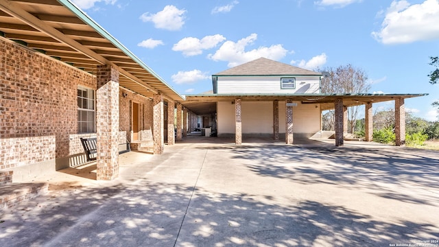 view of property exterior with a carport