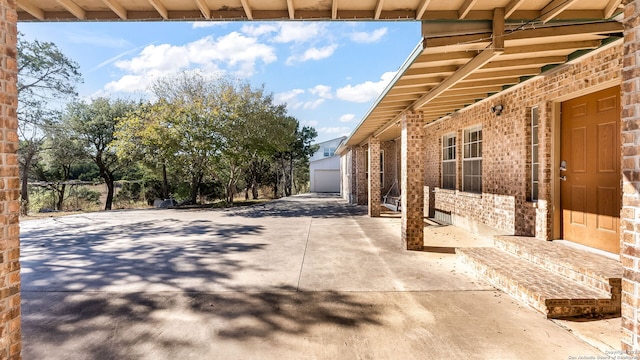 view of patio featuring a garage