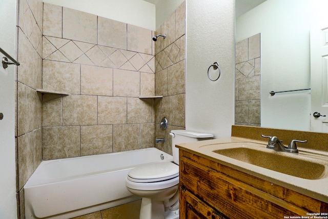 full bathroom with tile patterned floors, vanity, toilet, and tiled shower / bath combo