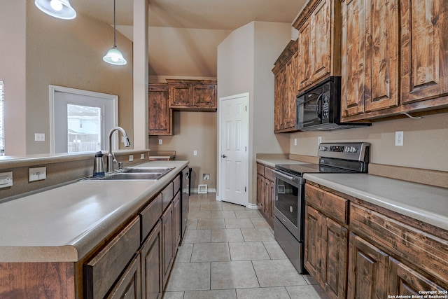 kitchen with appliances with stainless steel finishes, hanging light fixtures, sink, and light tile patterned flooring