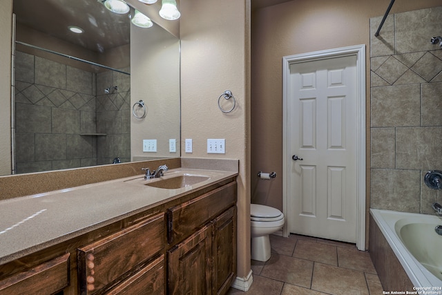 full bathroom with toilet, tiled shower / bath combo, vanity, and tile patterned flooring