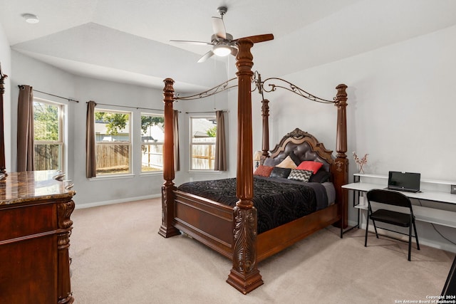 carpeted bedroom featuring lofted ceiling and ceiling fan