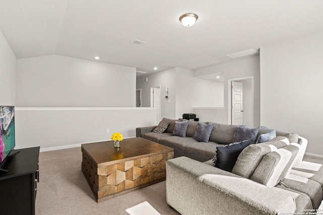 carpeted living room with vaulted ceiling