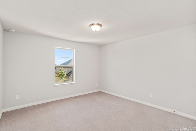 unfurnished room with carpet floors