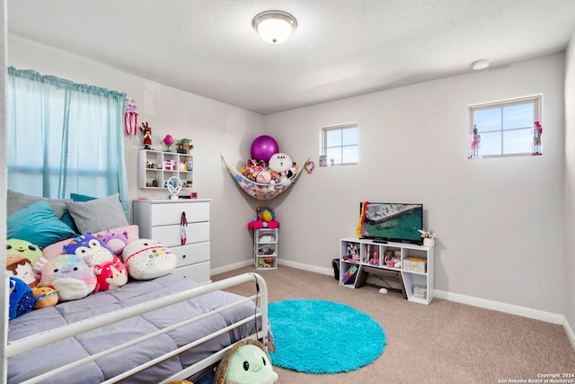 bedroom featuring light colored carpet