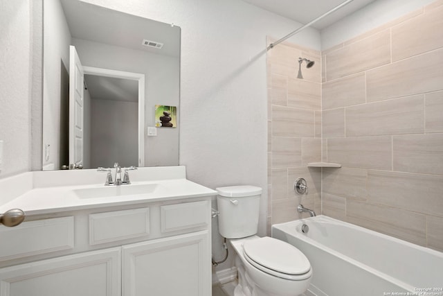 full bathroom with vanity, toilet, and tiled shower / bath combo