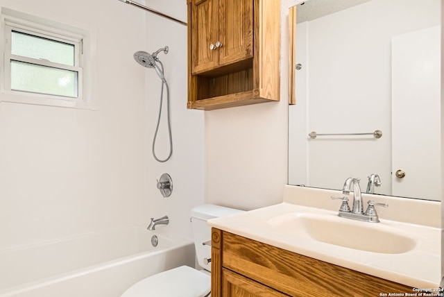 full bathroom featuring a textured ceiling, vanity, shower / bath combination, and toilet