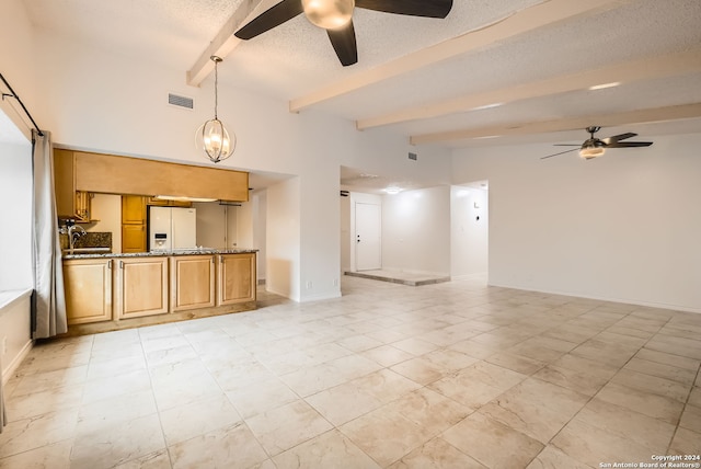 unfurnished living room featuring sink, beamed ceiling, high vaulted ceiling, a textured ceiling, and ceiling fan with notable chandelier