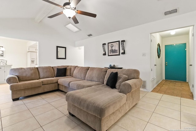 living room with vaulted ceiling with beams, ceiling fan, and light tile patterned flooring