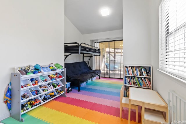 bedroom featuring vaulted ceiling