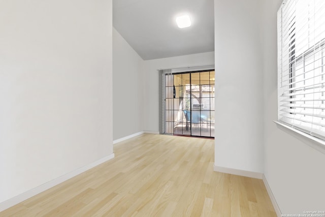 unfurnished room with light wood-type flooring