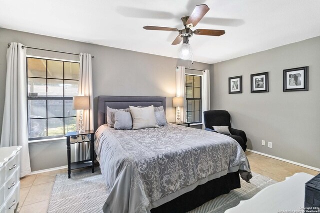 tiled bedroom with ceiling fan