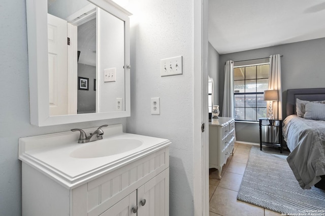 bathroom featuring tile patterned flooring and vanity