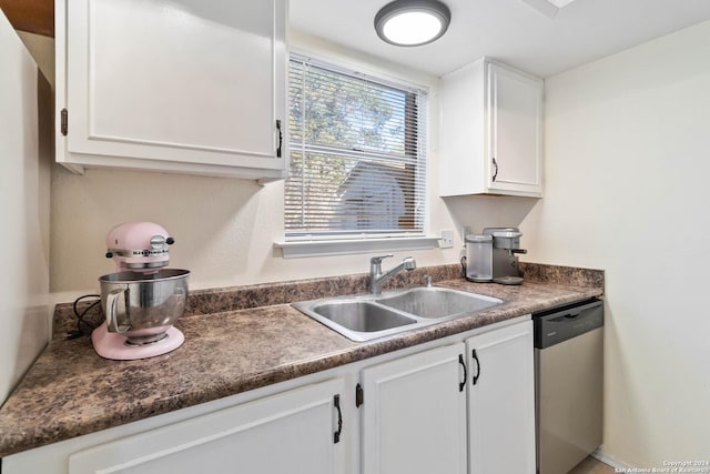 kitchen featuring sink, white cabinets, and stainless steel dishwasher