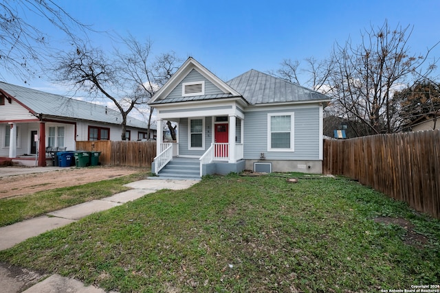 bungalow-style house with a front yard