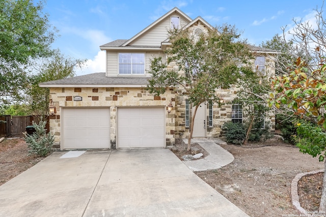 multi unit property featuring a garage