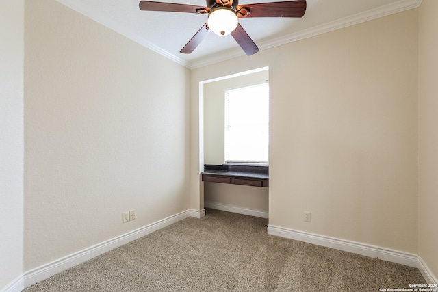 spare room with ceiling fan, carpet floors, and ornamental molding