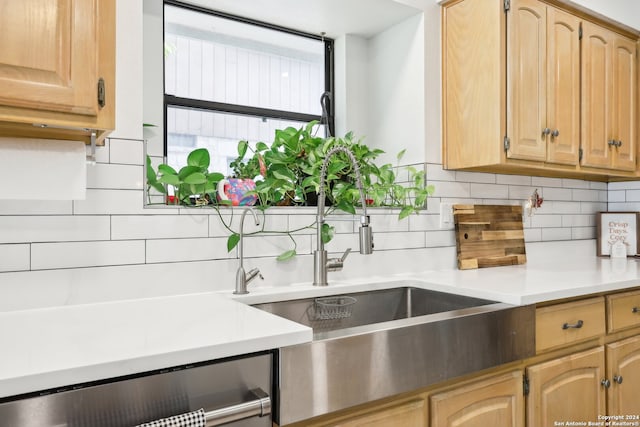 kitchen featuring light brown cabinets and backsplash