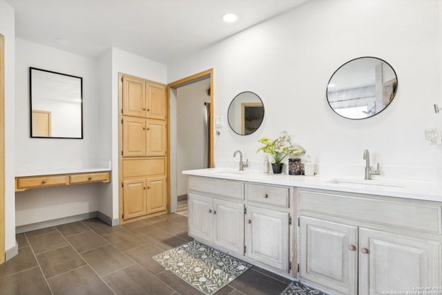 bathroom featuring tile patterned flooring and vanity