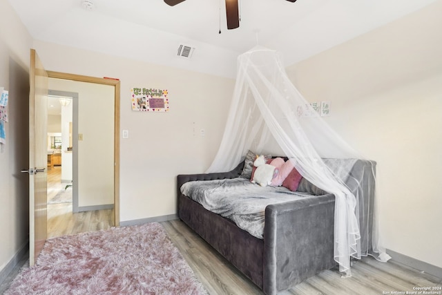 bedroom with wood-type flooring and ceiling fan