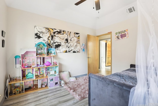 bedroom with hardwood / wood-style flooring and ceiling fan