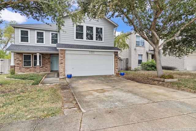 7303 Autumn Flower, Converse, TX 78109 - traditional-style home featuring brick siding, roof with shingles, a garage, driveway, and fence