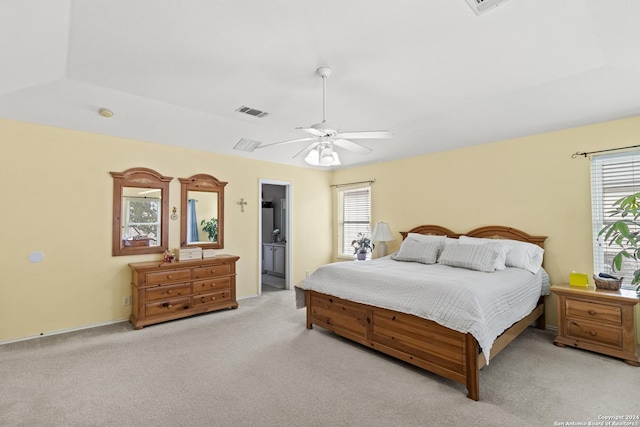 7303 Autumn Flower, Converse, TX 78109 - bedroom featuring light carpet, ceiling fan, and ensuite bathroom
