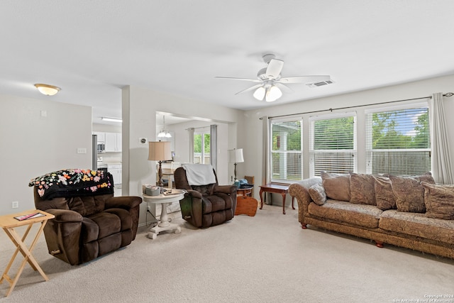 living room with carpet and ceiling fan