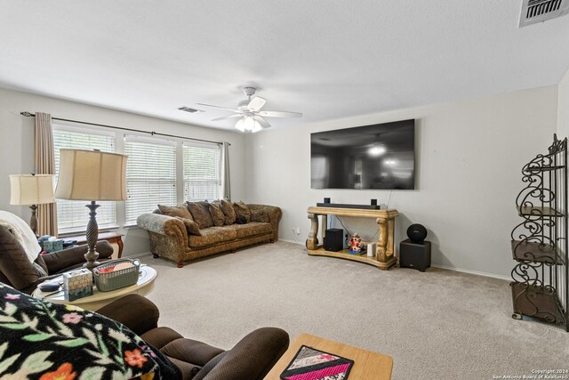 7303 Autumn Flower, Converse, TX 78109 - carpeted living area featuring a ceiling fan and baseboards