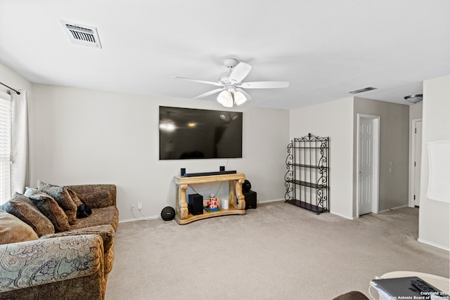 carpeted living room featuring ceiling fan