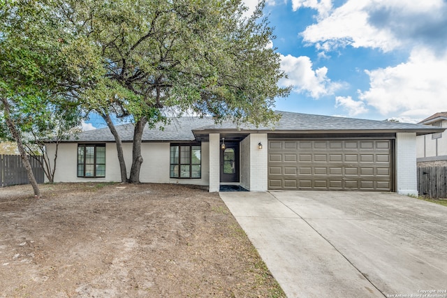 single story home with a garage