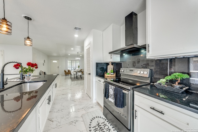 kitchen with sink, wall chimney exhaust hood, decorative light fixtures, white cabinets, and electric range