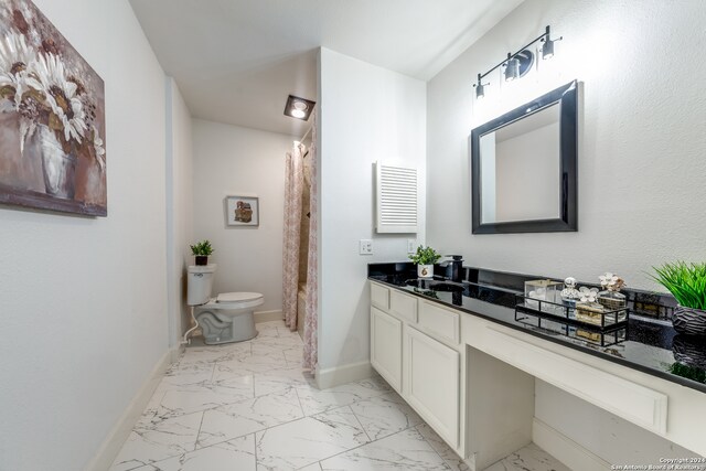 bathroom with vanity and toilet