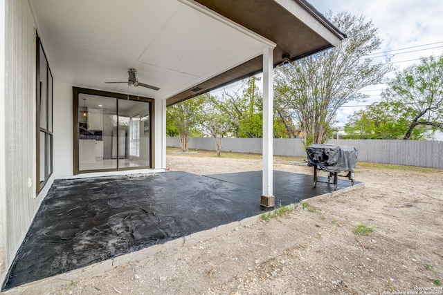 view of patio featuring ceiling fan and a grill