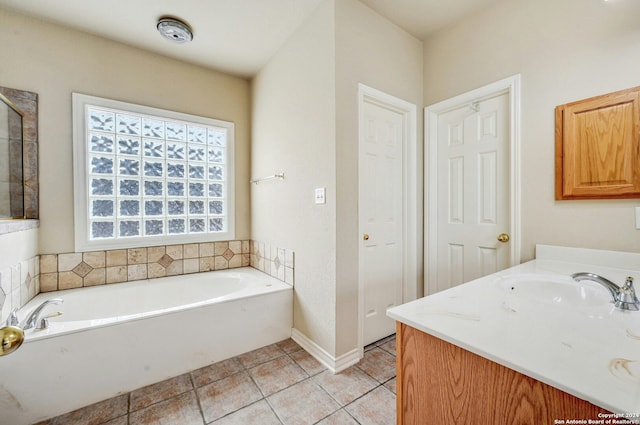 bathroom with vanity, tile patterned floors, and a bathtub