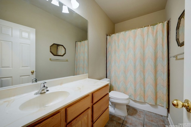 full bathroom with tile patterned floors, vanity, toilet, and shower / bath combo with shower curtain