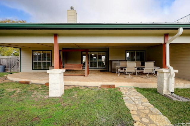 rear view of house featuring a patio