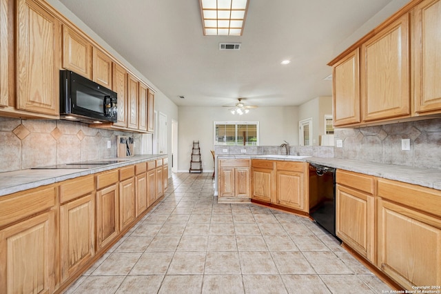 kitchen featuring sink, backsplash, ceiling fan, and black appliances