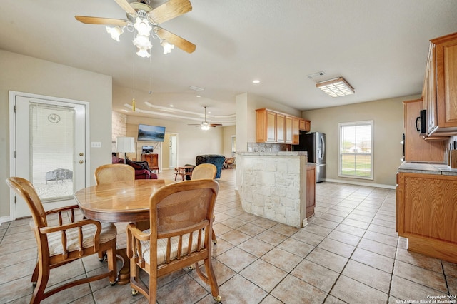 tiled dining room with ceiling fan