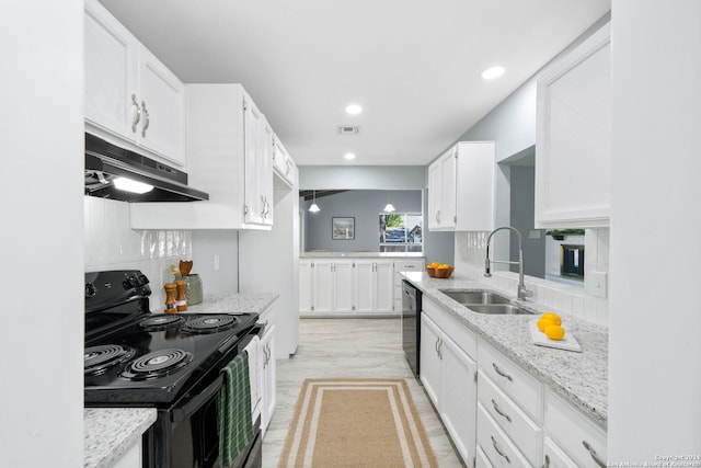 kitchen featuring white cabinetry, sink, black appliances, light stone counters, and light hardwood / wood-style flooring