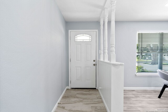 doorway to outside with light hardwood / wood-style floors