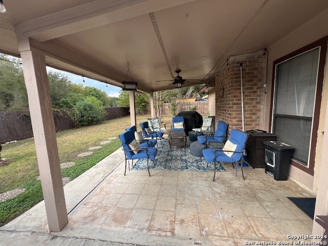 view of patio featuring ceiling fan