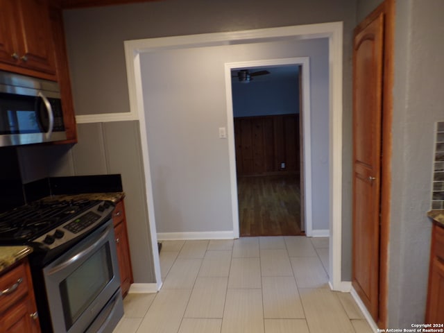 kitchen with stainless steel appliances and light hardwood / wood-style flooring