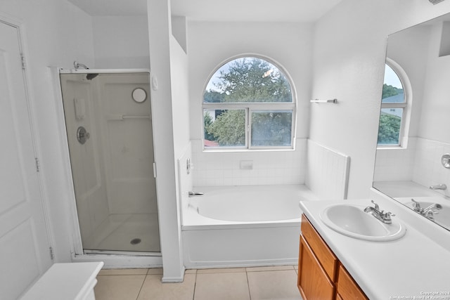 bathroom featuring vanity, tile patterned floors, and shower with separate bathtub