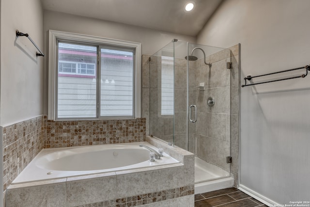 bathroom featuring independent shower and bath