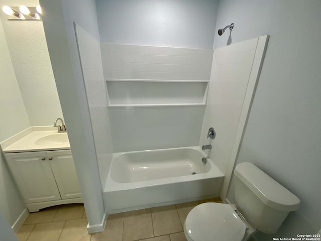 full bathroom featuring washtub / shower combination, tile patterned flooring, vanity, and toilet